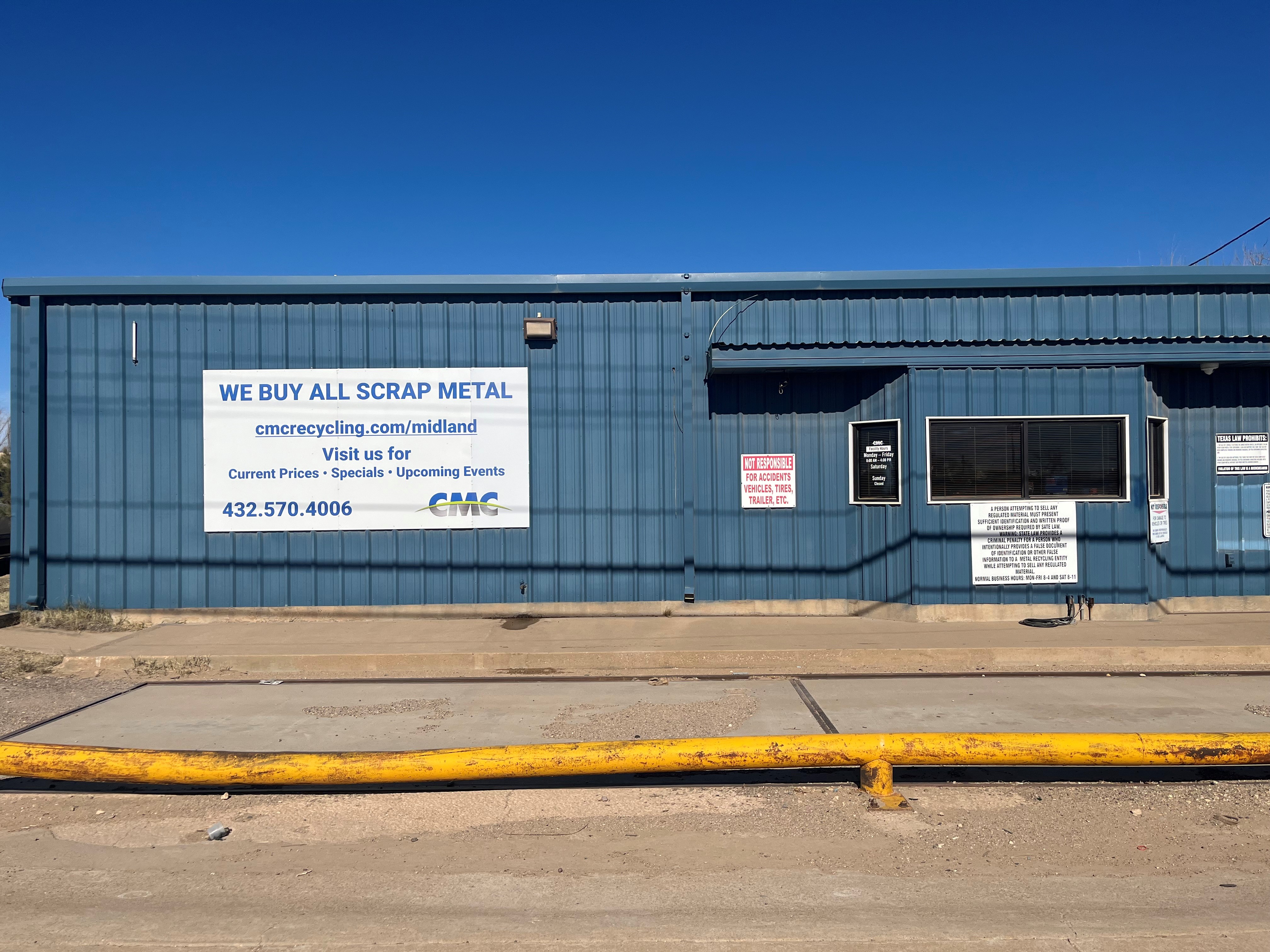 Photo of CMC Recycling Midland's main building with sign showing CMC's logo.